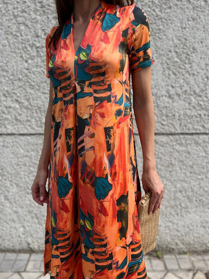 Vestido Midi escote pico estampado fondo naranja/choco